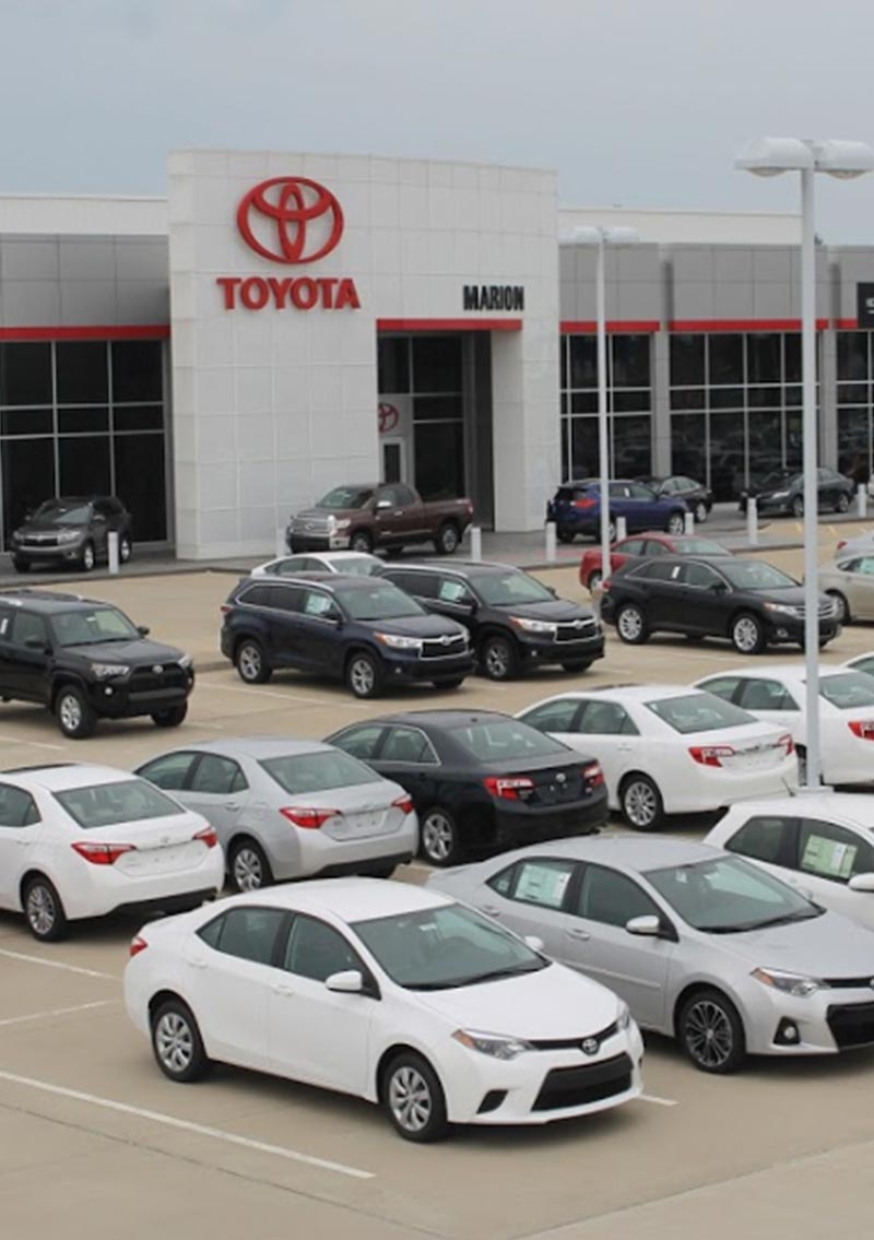 exterior of toyota dealership featuring compact sedans, sport utility vehicles, and trucks