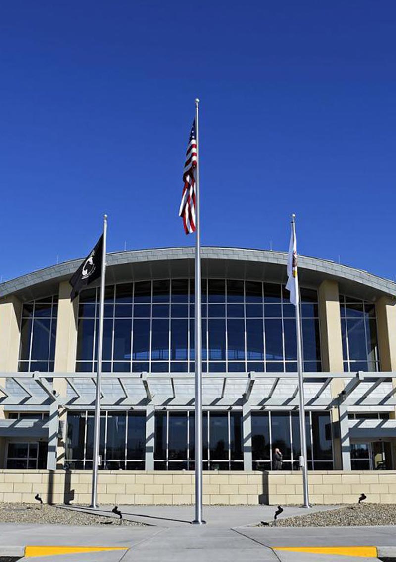 exterior of veteran's airport with flags