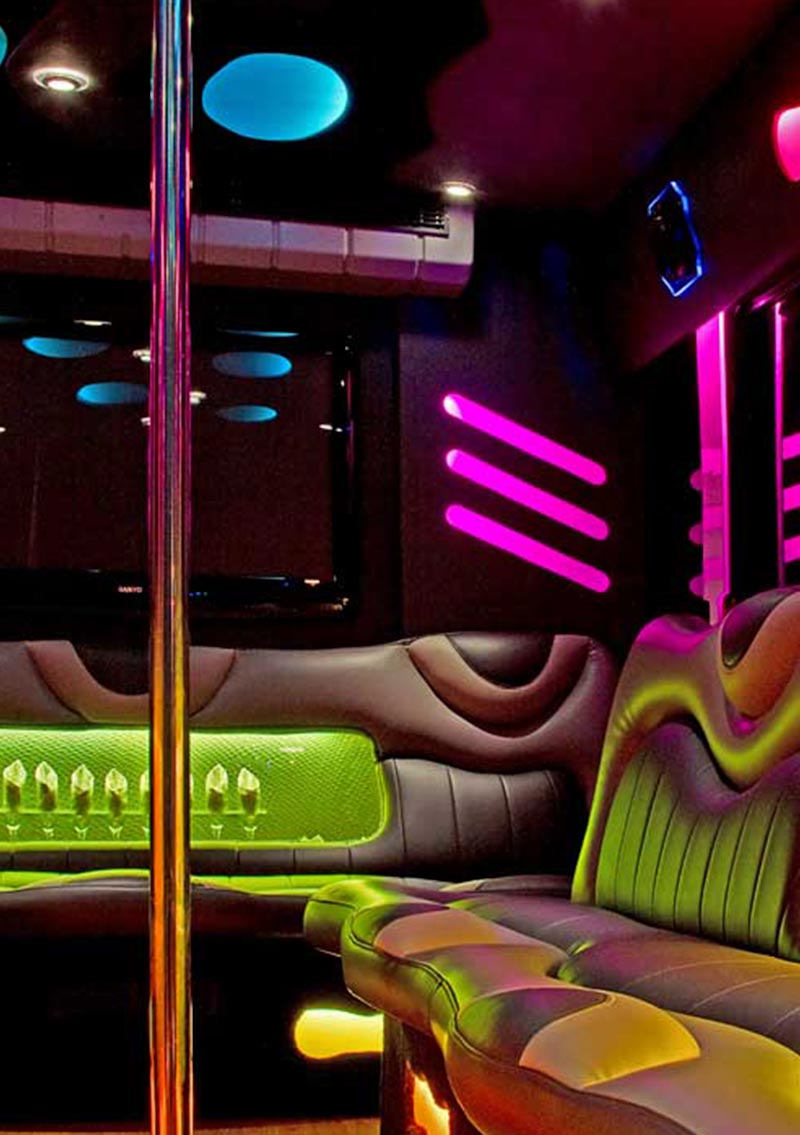 interior of party bus with neon lights and comfy seats