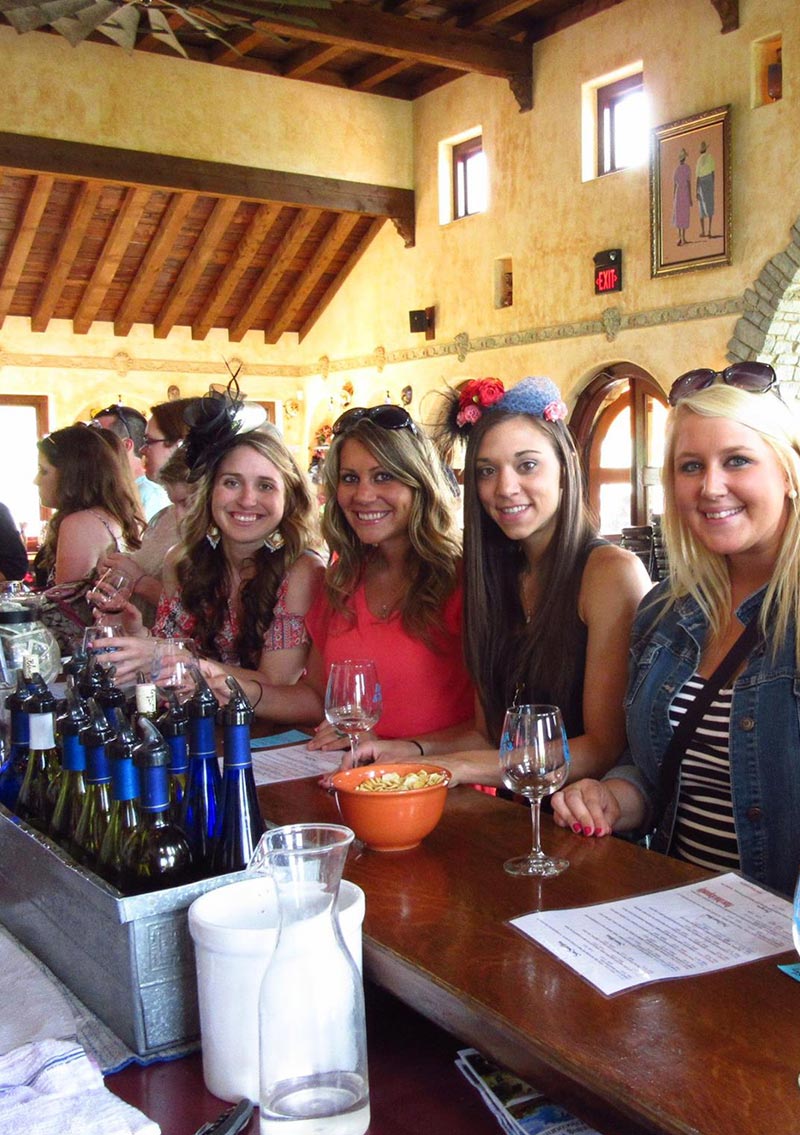 group of women enjoying wine at a bar