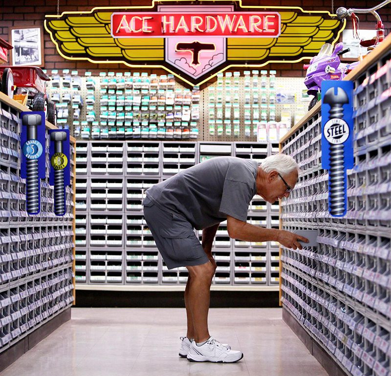 man looking through bins for hardware at ace hardware