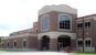 brick exterior of carterville high school with large windows on sides