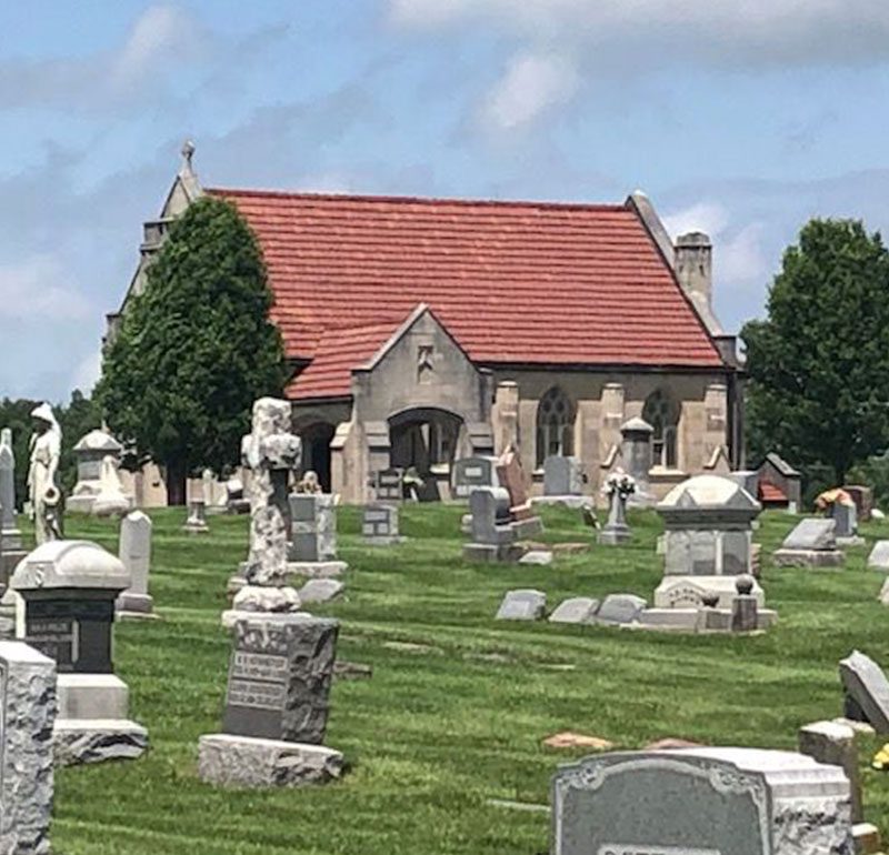 exterior of chapel with tombstones in foreground