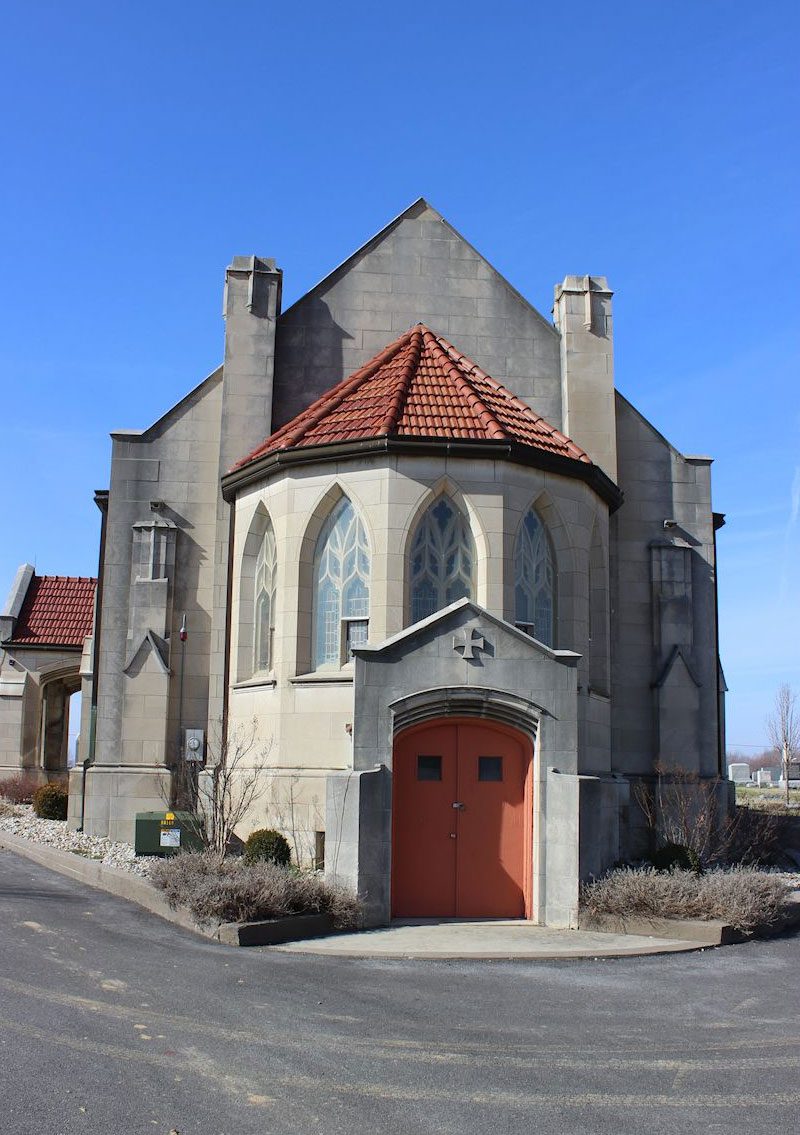 exterior of concrete and stained glass chapel