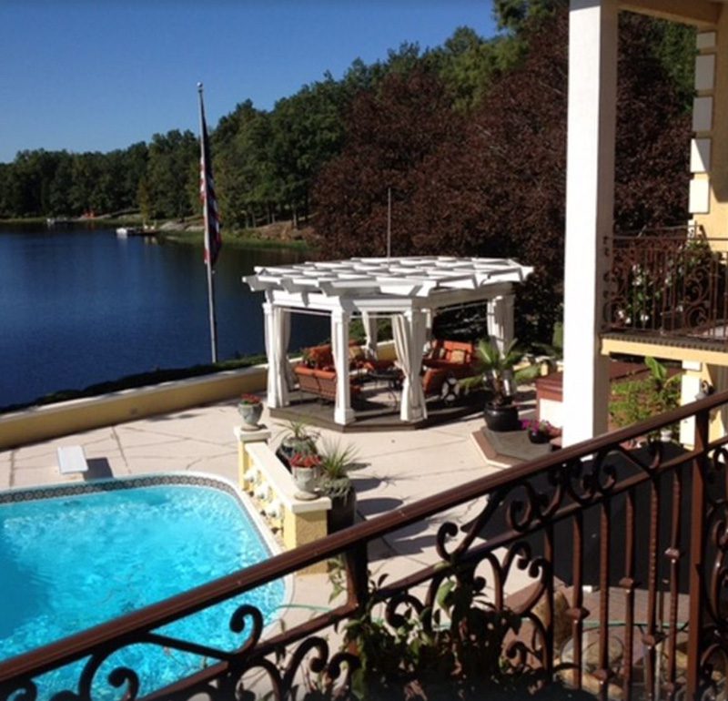 deck overlooking pool and lake
