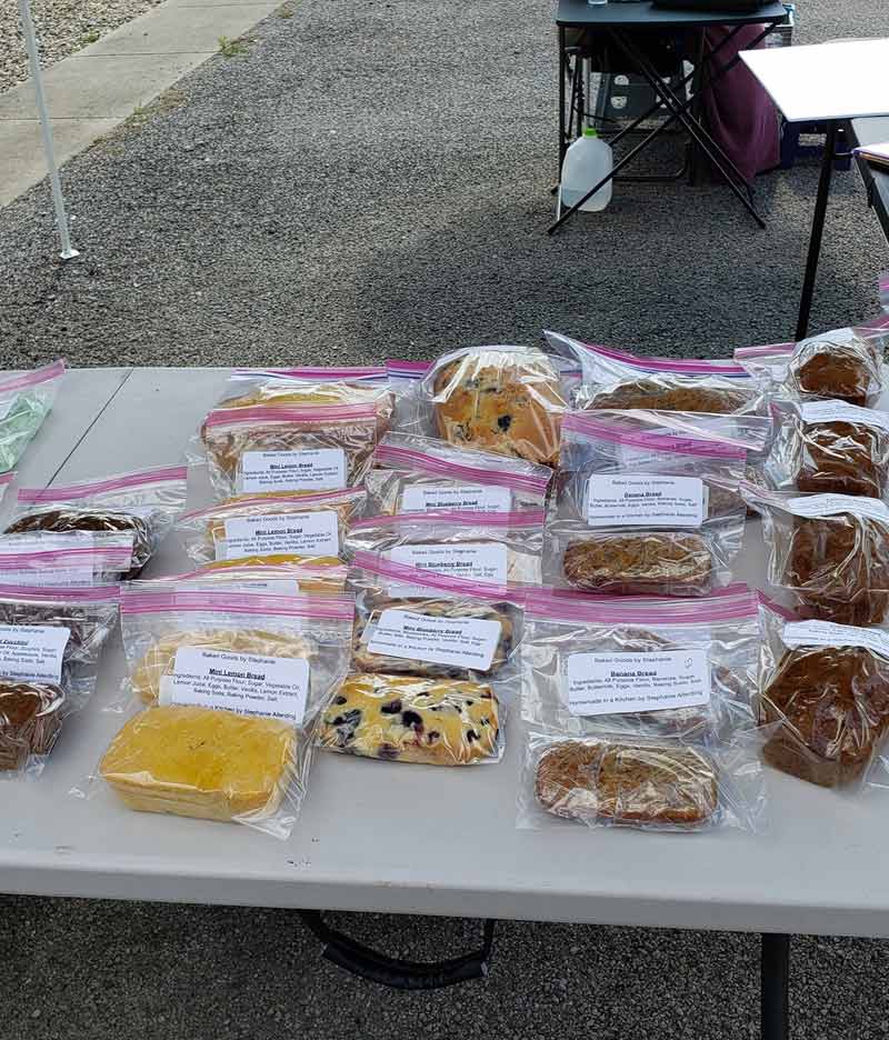 table filled with individually wrapped baked goods
