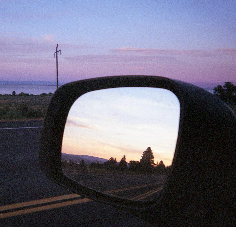 rearview mirror viewing purple sunset