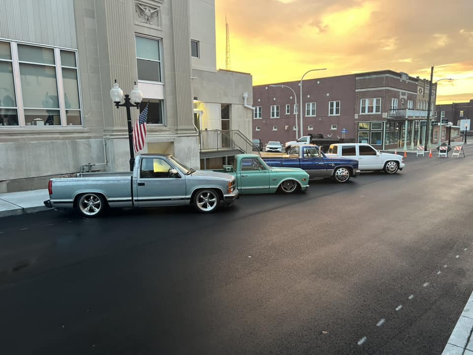 Trucks Lined Up by city hall in downtown marion against the sunset background Marion illinois